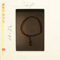 Red beaded necklace on display.