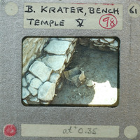 An old photograph of a stone structure with annotations on the border, possibly from an archaeological site.