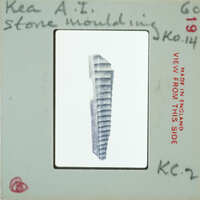 A postcard with a photograph of an ancient artifact, possibly a tool or weapon from Egypt.