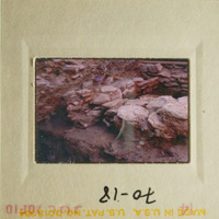 Slide with photo of rocky hillside and ruins.