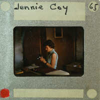 A vintage photograph of a woman with a film strip border.