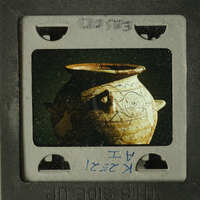 Ancient pottery with intricate designs on display.