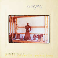 A photo of a pottery display inside a workshop.