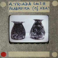 Two decorative vases with intricate designs, possibly from an archaeological site.