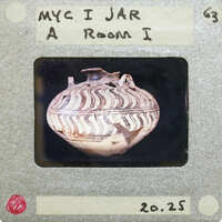 Picture of decorated jar in profile.