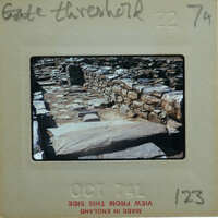 A photograph of an ancient stone structure with a visible date stamp on the bottom right corner.