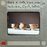 Three pots (K.2091, K.3302, K.2030) in profile on table.