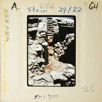 Ancient ruins with stone steps and walls, possibly from an archaeological site.