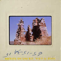 Old stone ruins with vegetation on them, photographed during daylight.
