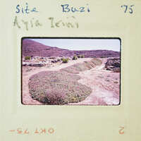 An old photograph of a rugged landscape with shrubs and rocks, possibly from the 1970s.
