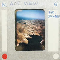 Landscape with mountains and a body of water.