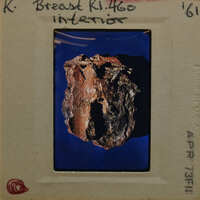 Terracotta fragment (K1.460) on blue background.