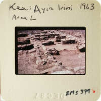 Ancient ruins with stone columns and walls, photographed on film.