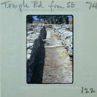 Parallel stone walls with surface between them.