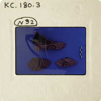 A photograph showing three ancient pottery shards with intricate designs.