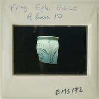 Ancient Greek vase with intricate designs on display.