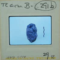 A small, purple rock on a white background.