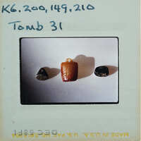 A slide of three rocks with a label indicating "Tomb 31.".