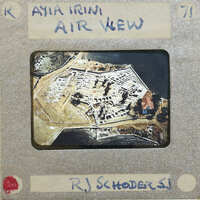 Aerial photograph of a fortified island with buildings and waterways.