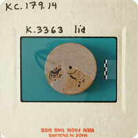 Ancient coin with intricate designs and markings.