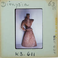 Detail of almost complete terracotta figurine from the back minus right arm.