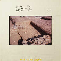 Old ruins with exposed layers of stone and dirt.