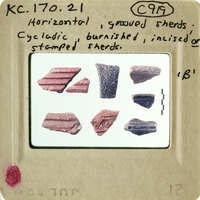 Photographs of ancient pottery shards with various colors and designs.