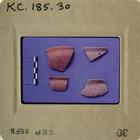 Old pottery shards on blue background.