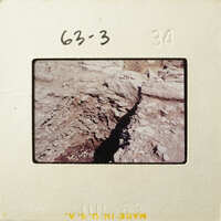 A photograph showing an excavation site with exposed layers of rock and soil.