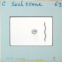 Small circular stone with carvings.