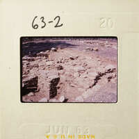 Old photograph of an archaeological site with ruins and rocks, dated June 1968.