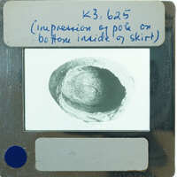 Skirt of teracotta figurine from the top showing the base.