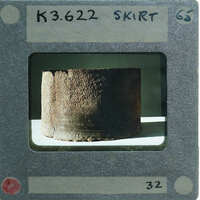 Broken base of terracotta figurine skirt.