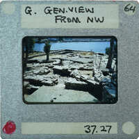 A photograph of a historical site with ruins and water, taken from a vintage Polaroid camera.