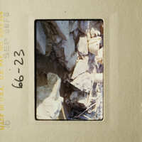 The photo shows a rocky area with rubble, possibly after an earthquake or natural disaster.