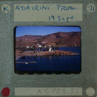 A vintage photograph of a scenic coastal area with mountains and water, labeled "Ayii Athoni Prom" from September 1971.