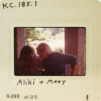 Two people sitting together with a vintage photo look. Catalog number KC.185.1