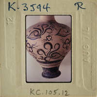 Ancient vase with intricate designs and patterns on its surface.