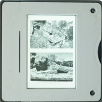 A small digital device displaying two black and white images on its screen.