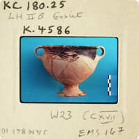 Ancient Greek vase with visible handles and patterns.