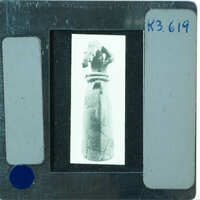 Headless restored terracotta figuring from front.