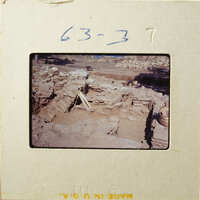 This is an image of ancient ruins with visible stone structures and excavation areas.