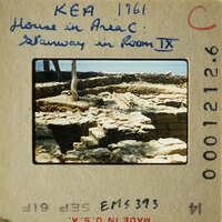 Ancient ruins with stone steps and walls, possibly from an archaeological site.