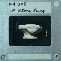 Broken white stone carved lamp from the side, K4.305.