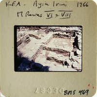 Ancient ruins with stone walls and foundations, possibly part of an archaeological site.