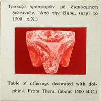 Three legged table with fish decoration, likely from ancient Thera circa 1600 BCE.