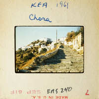 A photograph of an old village with stone houses and narrow streets, possibly from the 1960s.