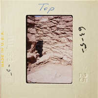 The image shows an ancient stone structure, possibly ruins from a historical site.