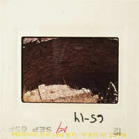 Ancient stone structure with sunlight streaming through an opening.