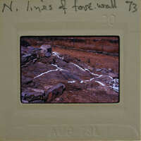 Image of a film strip with a picture of rocks and dirt on it.